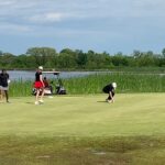 Merritt High School Girls golf team hitting at the Falconhead Resort and Golf Club